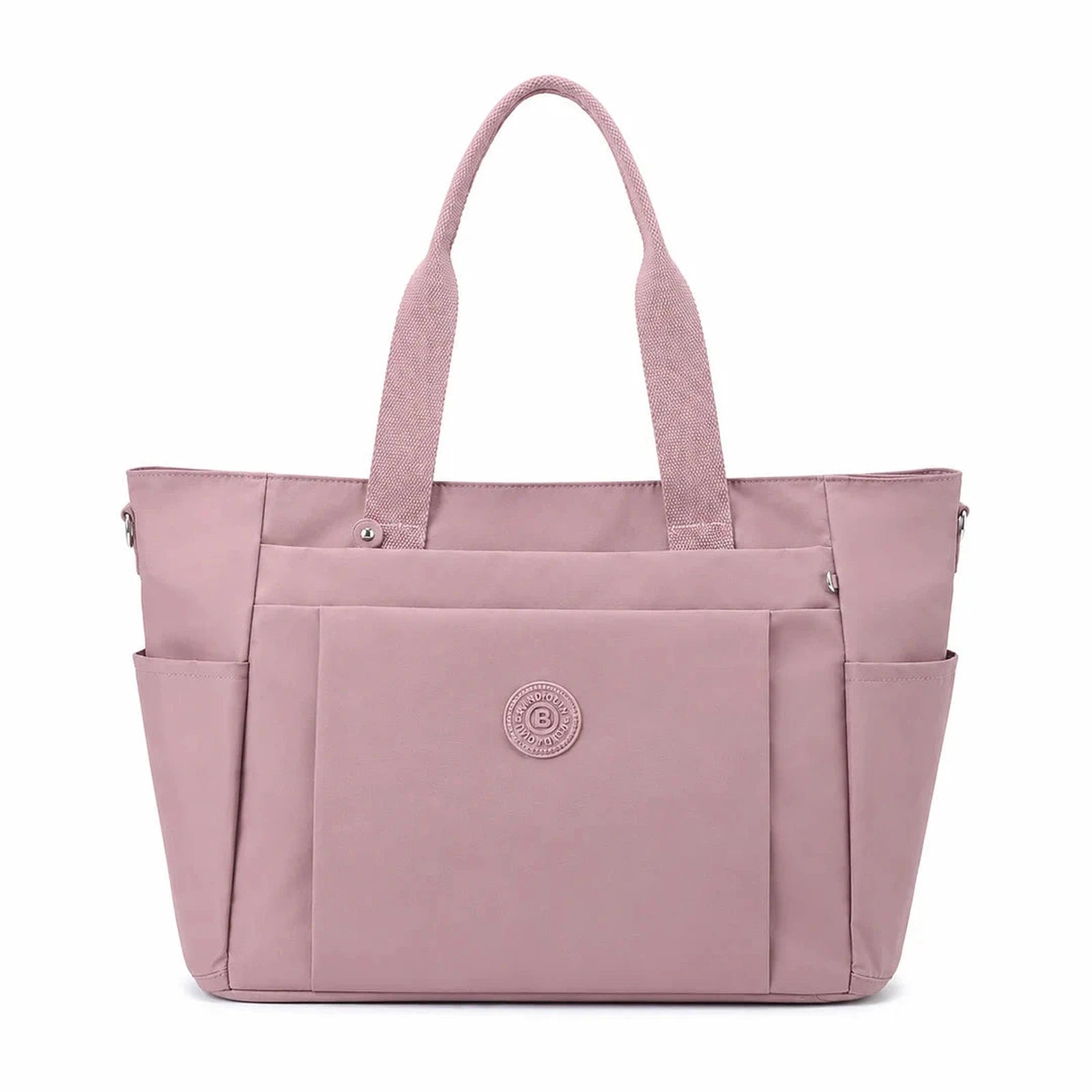 תיק צד יומיומי COOLPASE Carry Travel Tote בצבע ורוד עתיק - מבט קדמי, מתלבש על מזוודה עם כיסים מרובים