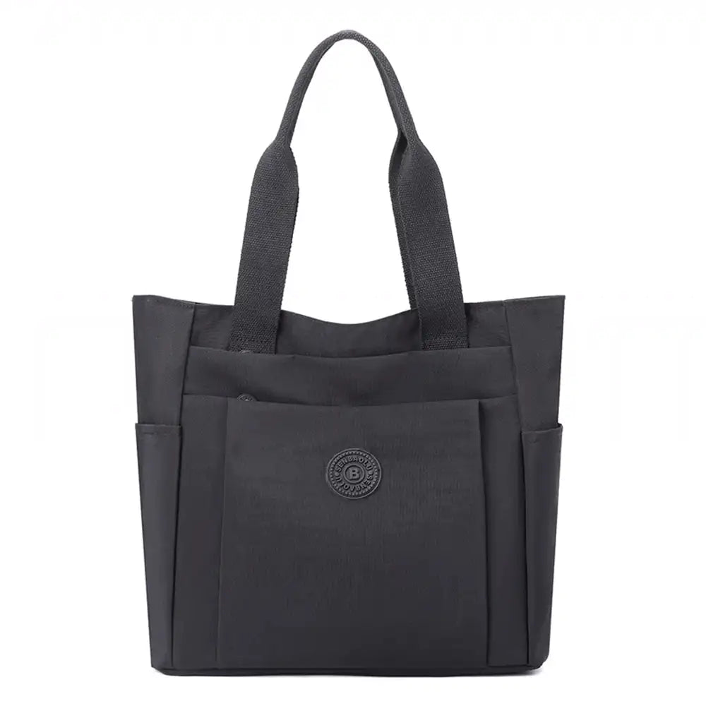תיק צד יומיומי לעבודה וללימודים COOLPASE דגם Carry Travel Tote בצבע שחור, עשוי בד אוקספורד דוחה מים, מבט מלפנים
