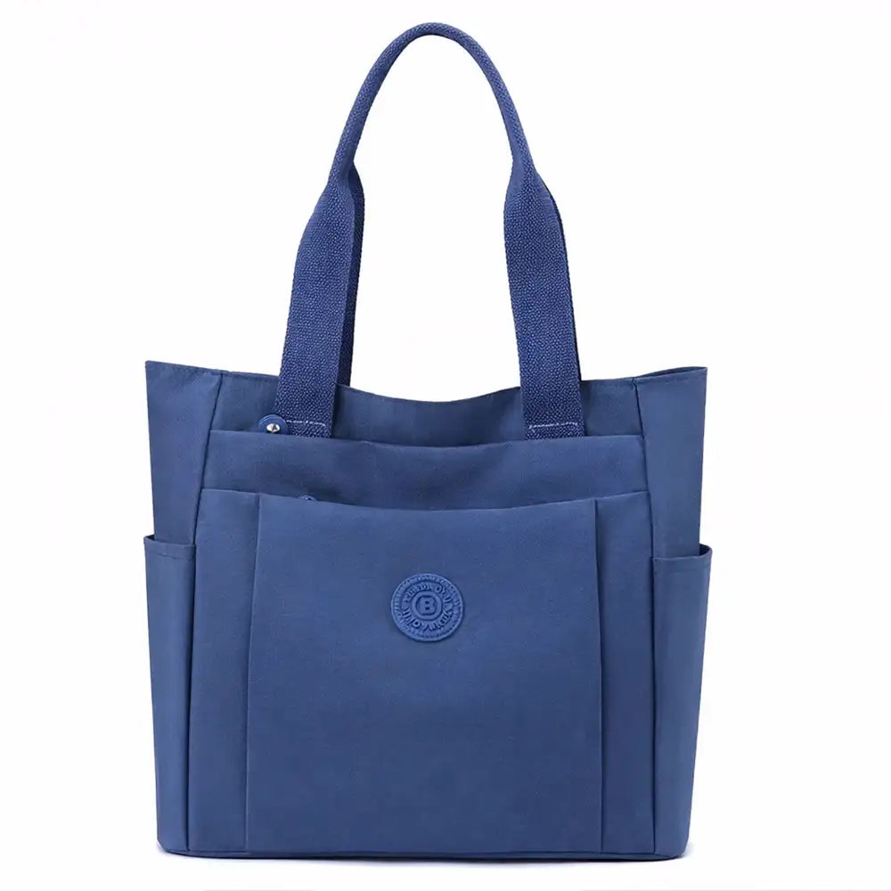 תיק צד יומיומי לעבודה וללימודים COOLPASE דגם Carry Travel Tote בצבע כחול, עשוי בד אוקספורד דוחה מים, מבט מלפנים
