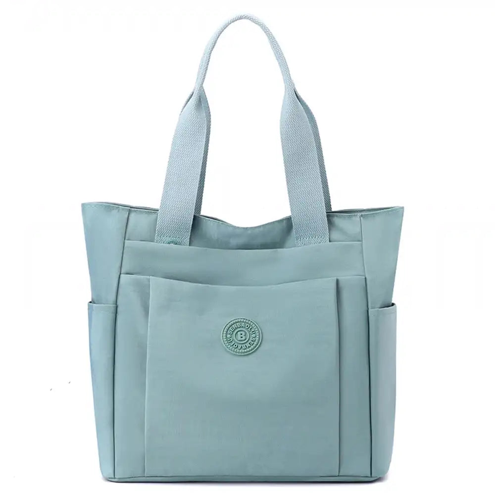 תיק צד יומיומי לעבודה וללימודים COOLPASE דגם Carry Travel Tote בצבע מנטה, עשוי בד אוקספורד דוחה מים, מבט מלפנים