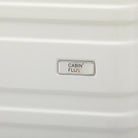 מזוודה עליה למטוס 20 אינץ׳ CABIN FLUX דגם Celine, תקריב מעטפת ABS קשיחה ולוגו מותג רשום
