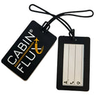 זוג תגי מזוודה שחורים מסיליקון CABIN FLUX DUO ID - לוגו בולט וחלון שקוף לפרטים - זווית אלכסונית