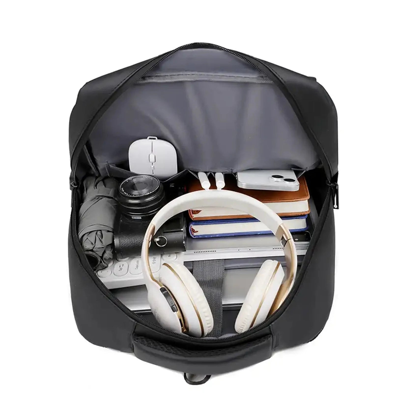 תיק גב קלאסי CABIN FLUX Ranger עם פתיחה רחבה ומבט מלמעלה על התכולה הפנימית הכוללת לפטופ ואוזניות