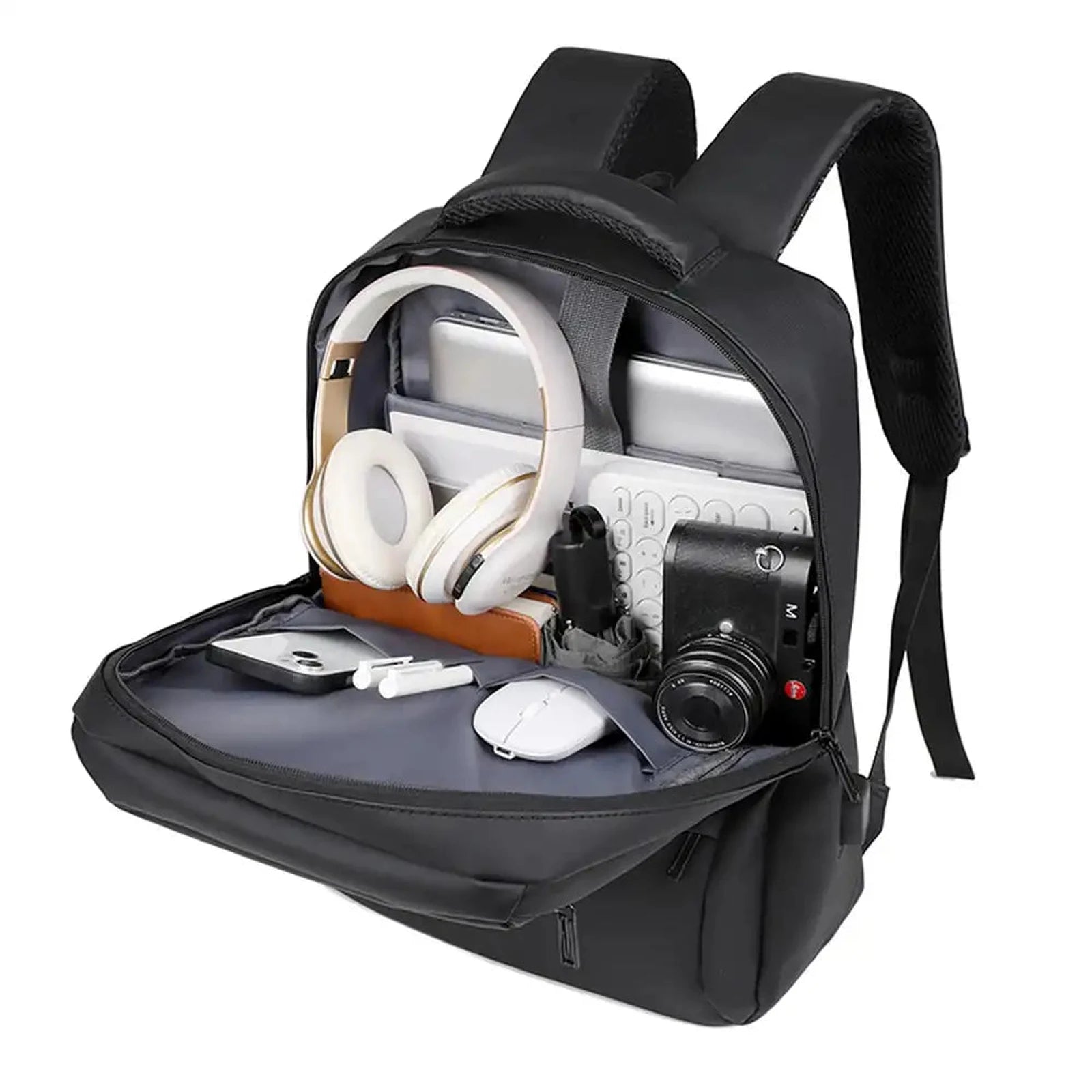 תיק גב CABIN FLUX Ranger במבט פתוח מלא המציג שני תאים עם לפטופ אוזניות מצלמה וציוד יומיומי