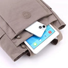 תיק צד יומיומי לעבודה וללימודים COOLPASE דגם Carry Travel Tote עם כיס קדמי רחב לטלפון ולטאבלט, מבט מקרוב