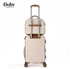תיק האיפור Goby London Ocean Coral שמנת מולבש על מזוודת טרולי באמצעות רצועת גומי, מבט מאחור