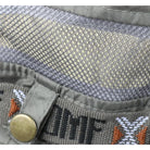תקריב רשת אוורור ירוקה של כובע Metura DMF-X עם כפתור snap לקיפול שוליים, פוליאסטר נושם